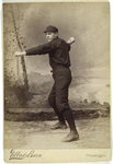 Unidentified baseball player in dark uniform - pitching form