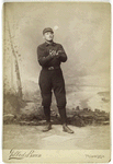 Unidentified baseball player in dark uniform - catching form
