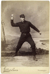 Unidentified baseball player in dark uniform - throwing form