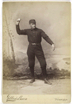 Unidentified baseball player in dark uniform - throwing form