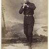 Unidentified baseball player in dark uniform - batting form -bat on shoulder