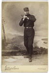 Unidentified baseball player in dark uniform - batting form -bat on shoulder