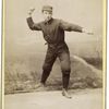 Unidentified baseball player in dark uniform - throwing form