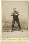 Unidentified baseball player in dark uniform - catching form