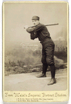 Unidentified baseball player in dark uniform - batting form