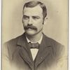 Unidentified man with mustache - wearing a suit and bow tie - portrait