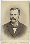 Unidentified man with mustache - wearing a suit and bow tie - portrait