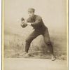 Unidentified baseball player in dark uniform - catching form
