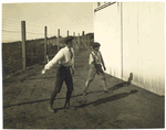 Fig. 3: Two boys with a ball and bat, playing Barn Ball