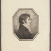 Young man with curly hair and sideburns, wearing scarf and jacket, facing right