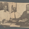Three seated men
