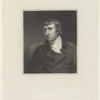 Man with combed forward bangs and ear-length hair in scarf and jacket, facing left