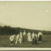 Women and boys playing cricket