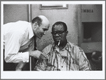 George Avakian and Louis Armstrong (seated) at Satch Plays Fats recording session