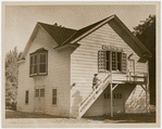 Exterior of the White Barn Theatre with Lucille Lortel on steps, ca. 1940s