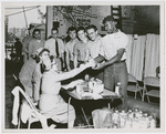 Crew members of the USS Lake Champlain (CVA-39) participating in the ship's two day blood drive, with the crew pledging to make a quota of 1000 pints