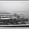 View of the Brooklyn piers and Governors Island from the Brooklyn Bridge
