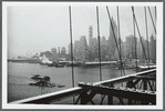 View of lower Manhattan as seen from Brooklyn Bridge on a dreary winter day