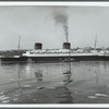 The Liberte leaving New York, having just been turned around 90 [degrees] by tugs