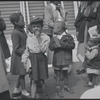 Children in street with party hats