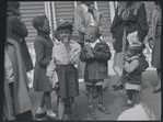 Children in street with party hats