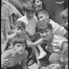 Children and card players in street, summer