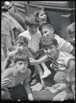 Children and card players in street, summer