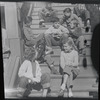 Children on house steps, summertime