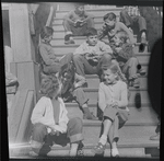 Children on house steps, summertime