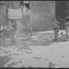 Children playing in a sprinkler