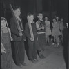 Children playing war with stick rifles