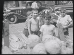 Children with cabbage vendor