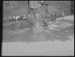 Children playing in a sprinkler