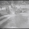 Children playing in a sprinkler