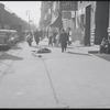 Man asleep on sidewalk