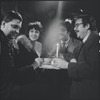 Al Carmines, Irene Fornes, Harry Koutoukas, and Larry Kornfeld sitting at table at Caffe Cino before performance of "The White Whore and the Bit Player"