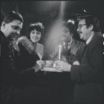 Al Carmines, Irene Fornes, Harry Koutoukas, and Larry Kornfeld sitting at table at Caffe Cino before performance of "The White Whore and the Bit Player"