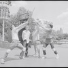 Performers rehearsing fight choreography (unidentified man in foreground backbent) for the stage production Henry IV, [Part I] at the Delacorte Theater