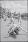 Performers rehearsing fight choreography (swords raised) for the stage production Henry IV, [Part I] at the Delacorte Theater