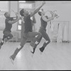Musicians leaping in rehearsal for the stage production Dreamgirls