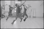 Musicians leaping in rehearsal for the stage production Dreamgirls