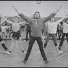 Unidentified man in rehearsal (with chorus behind) for the stage production Woman of the Year