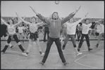Unidentified man in rehearsal (with chorus behind) for the stage production Woman of the Year