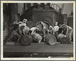 Men moving barrels