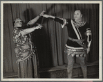 Minto Cato as Azucena and Parker Watkins as Manrico, swearing vengeance on a sword