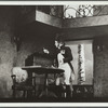 Man standing by table