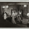 Two men and woman in evening dress