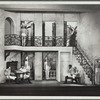 Three men sitting, others on guard