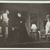 Woman and two men, standing