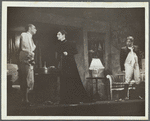 Woman and two men, standing